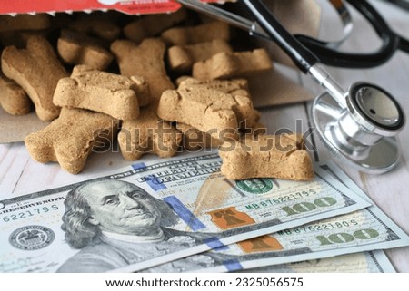 Vet veterinarian bill invoice with stethoscope and dog treats. Medical cost of pets concept  Royalty-Free Stock Photo #2325056575