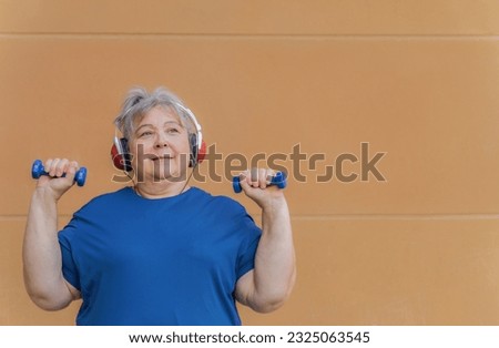 overweight elderly woman exercising for weight loss Royalty-Free Stock Photo #2325063545