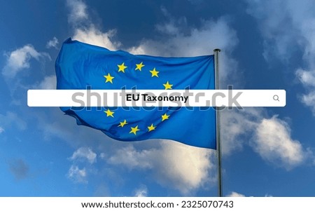 European Union flag waving with search bar and 'EU Taxonomy' search query Royalty-Free Stock Photo #2325070743