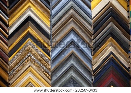Patterned array of frame samples.  Colorful frame sections in a variety of colors. 