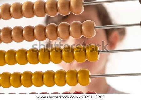 Child Hand Playing with Abacus - Learning Concept