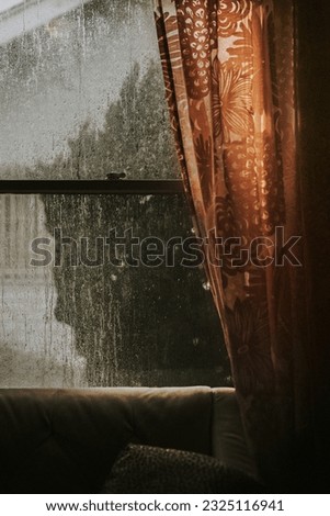 Rainy day outside the window Royalty-Free Stock Photo #2325116941