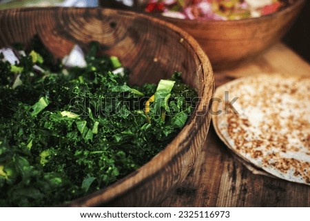 Chopped kale in a wooden bowl