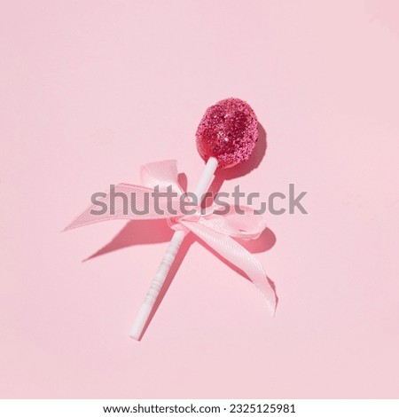 Romantic glittery lollipop, creative aesthetic girly layout, retro disco style, pastel pink background.