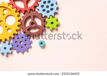 Top view of colorful gears. Corporate work and modern business process concept. High quality photo Royalty-Free Stock Photo #2325136433