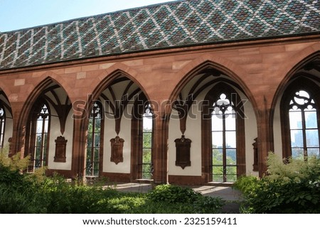Basel, Switzerland - 06 15 2023: The Cathedral and Minster built between the 12th and 15th centuries, gothic architecture, has a place called Pfalz where you can see the city and the Rhine River. Royalty-Free Stock Photo #2325159411
