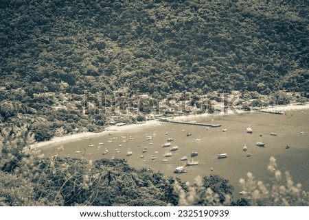 Old black and white picture of The big tropical island Ilha Grande Abraao beach panorama drone from above Angra dos Reis Rio de Janeiro Brazil.