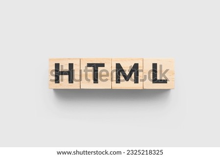 HTML (Hypertext Markup Language) wooden cubes on grey background