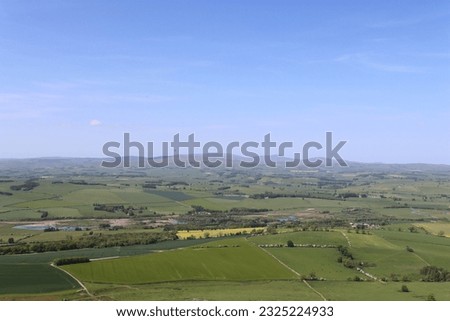 View over rolling Northumberland countryside towards the Cheviot Hills, from the summit of Simonside