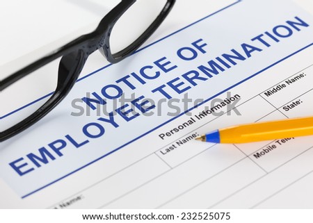 Notice of employee termination with glasses and ballpoint pen. Royalty-Free Stock Photo #232525075