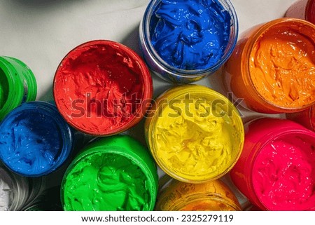 
Top view Collection of colorful smooth gradient background for print fabric and tee shirt. graphic design. 
various colors for shirt printing packed in glass bottles lined up.colorful background.

