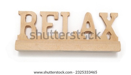 Relax word - in letterpress wood block on white background