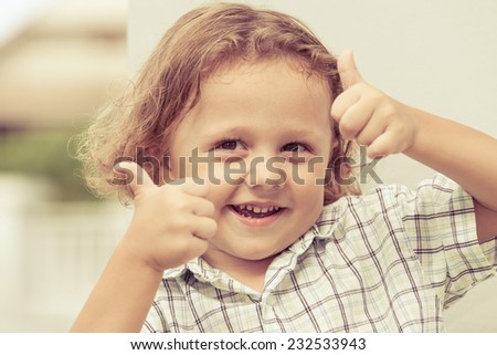 portrait of a cute little boy at the day time