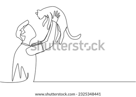 Single one line drawing of young handsome man with casual t-shirt holding his cute cat. Male pet owner plays with little cat. Concept of caring animals. Continuous line design graphic illustration