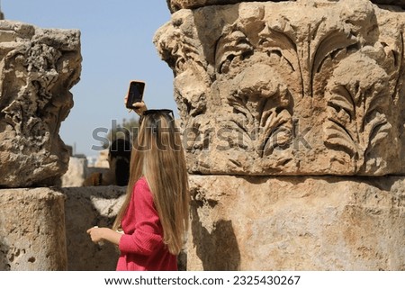 jordan amman roman citadel blonde woman taking pictures with mobile