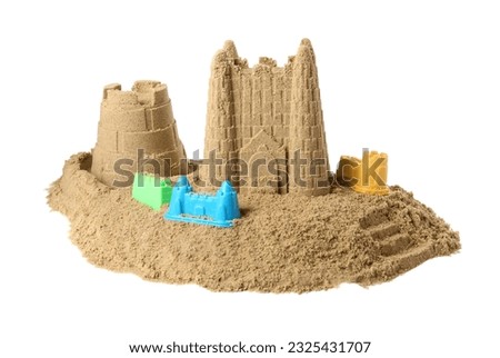 Beautiful sand castle and plastic molds isolated on white. Outdoor play