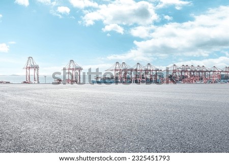 Empty asphalt road and container port background Royalty-Free Stock Photo #2325451793