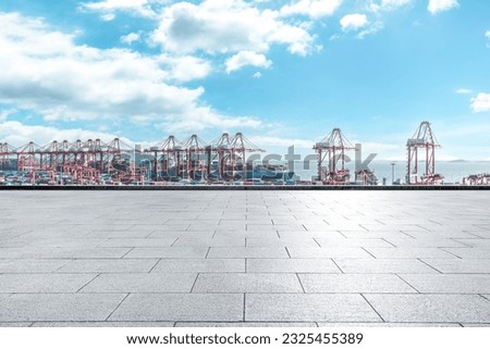 Empty square road and container port background Royalty-Free Stock Photo #2325455389