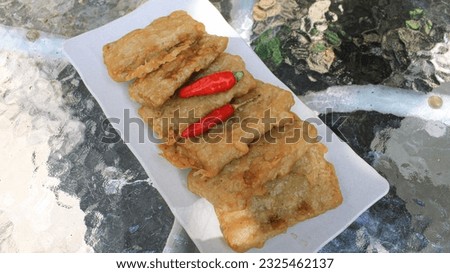 flour fried tempeh. Central Javanese food called gorengan is eaten with cayenne pepper