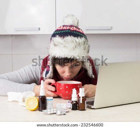 Woman with flu at the laptop