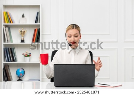 customer service cute blonde girl office shirt with headset and computer on the call with red cup