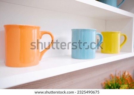 Drinking glasses are arranged on the shelf.
