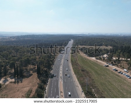 Wide landscape wide view of a highway, forrest fdrom a drone's view