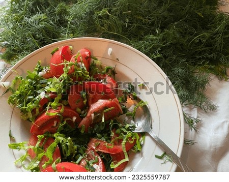 Fresh summer salad of greens and tomato.  Uzbek tomatoes, lettuce, dill, sorrel, onion, garlic, vegetable oil