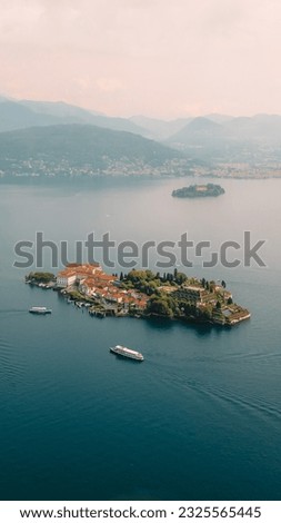 Aerial view of Isola Bella drone panoramic view. Isola Bella is one of the Borromean Islands of Lago Maggiore in north Italy, near Stresa and Arona. Borromean Islands, Lake Maggiore, Piedmont, Europe. Royalty-Free Stock Photo #2325565445