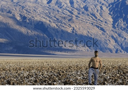 Random guy in the salt landscape and the dessert of Death Valley, California.