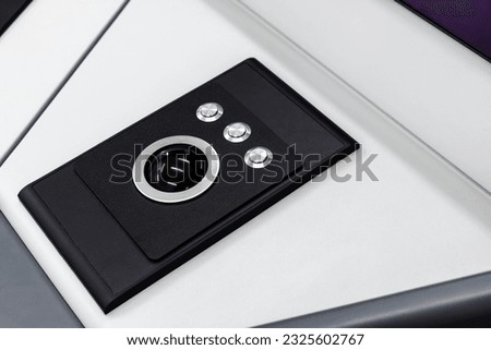 Built-in tabletop input device, trackball mouse is a pointing device consisting of a ball held by a socket containing sensors to detect a rotation of the ball about two axes Royalty-Free Stock Photo #2325602767
