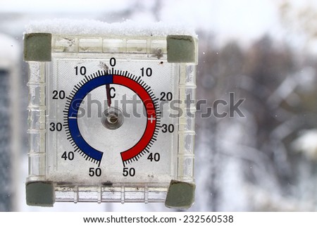 thermometer outdoors snow winter cold snap Royalty-Free Stock Photo #232560538