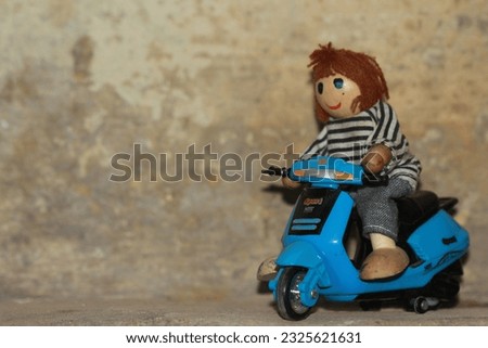 Miniature toy scooter bike rider cartoon 3D model.