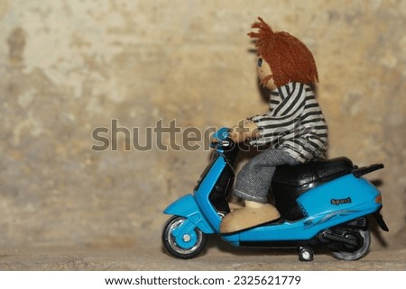 3d Cartoon toy rider biker miniature stock image.