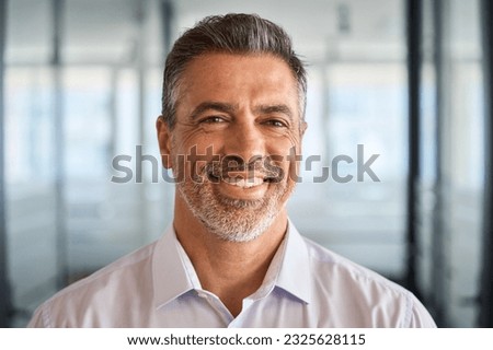Happy mid aged older business man executive standing in office. Smiling 50 years old company boss, mature confident professional manager, confident investor looking at camera, headshot portrait. Royalty-Free Stock Photo #2325628115
