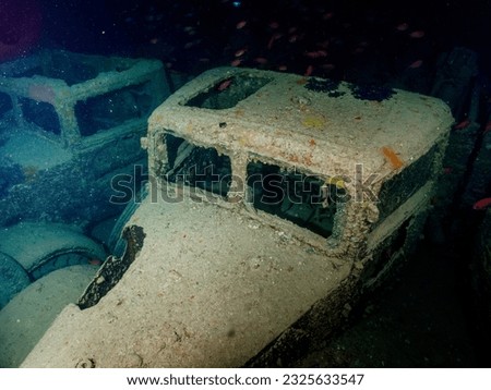 WWII truck inside the ship wreck of the SS Thistlegorm in the Red Sea, Egypt.  Underwater photography and travel. Royalty-Free Stock Photo #2325633547