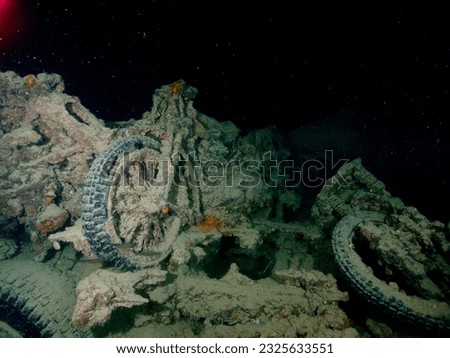 Motobikes or motocycles inside the ship wreck of the SS Thistlegorm in the Red Sea, Egypt.  Underwater photography and travel. Royalty-Free Stock Photo #2325633551