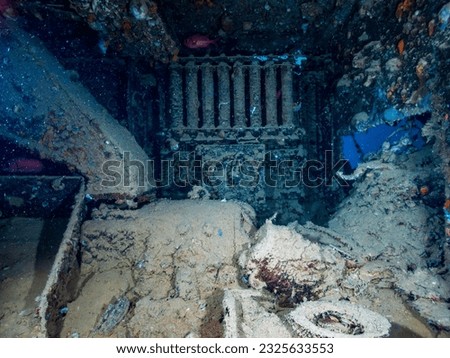 WWII Portable generator inside the ship wreck of the SS Thistlegorm in the Red Sea, Egypt.  Underwater photography and travel. Royalty-Free Stock Photo #2325633553