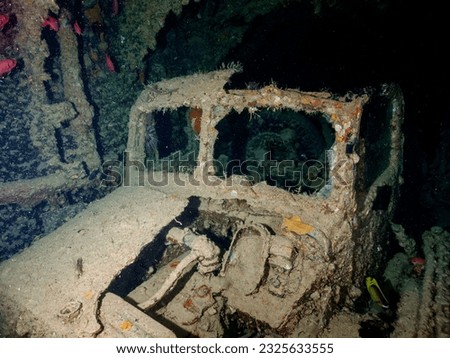 WWII truck inside the ship wreck of the SS Thistlegorm in the Red Sea, Egypt.  Underwater photography and travel. Royalty-Free Stock Photo #2325633555