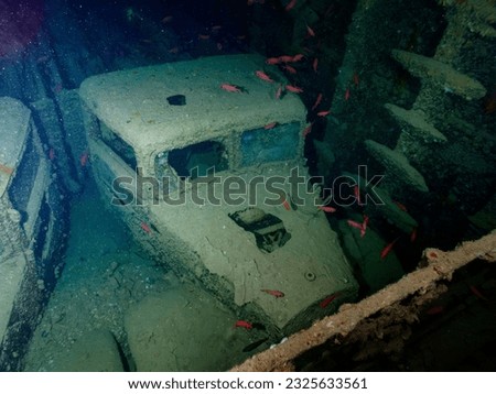 WWII truck inside the ship wreck of the SS Thistlegorm in the Red Sea, Egypt.  Underwater photography and travel. Royalty-Free Stock Photo #2325633561
