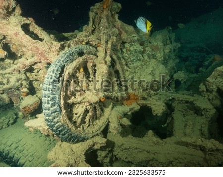 Motobikes or motocycles inside the ship wreck of the SS Thistlegorm in the Red Sea, Egypt.  Underwater photography and travel. Royalty-Free Stock Photo #2325633575