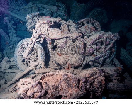 Motobikes or motocycles inside the ship wreck of the SS Thistlegorm in the Red Sea, Egypt.  Underwater photography and travel. Royalty-Free Stock Photo #2325633579