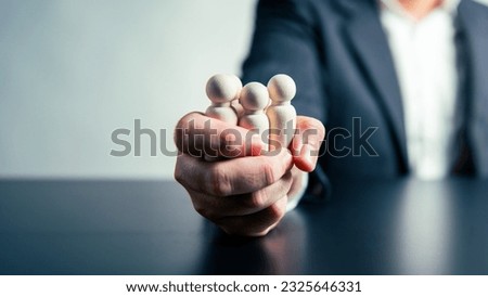 CEO Influence  Business Agreements and Employee Dismissals workforce labor businessman hand background. Tyrant and corruption concept. Royalty-Free Stock Photo #2325646331