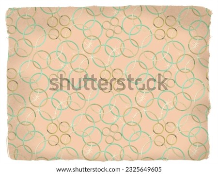 A hand drawing pattern made of yellow gold and green sparkling rings on a skin tone ripped paper