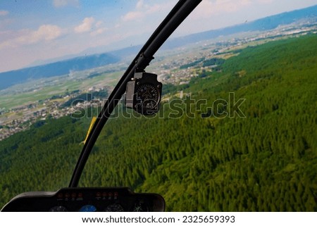 Get a bird's-eye view for green mountains from helicopter
