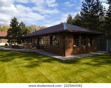 facade of a wooden house Royalty-Free Stock Photo #2325664181