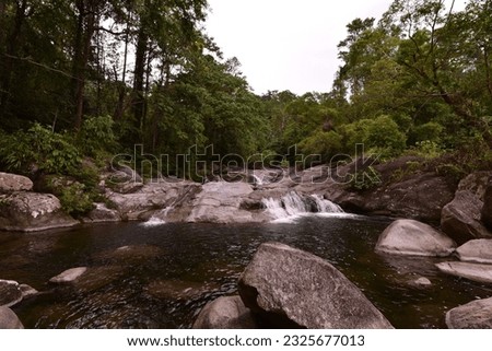 View of Karome Waterfall and green leaves background in Khao Luang national park at Lan Saka District 

 