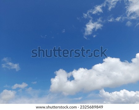 The white clouds on the blue sky are perfect for the background.  Skyscape on Lombok Island, Indonesia