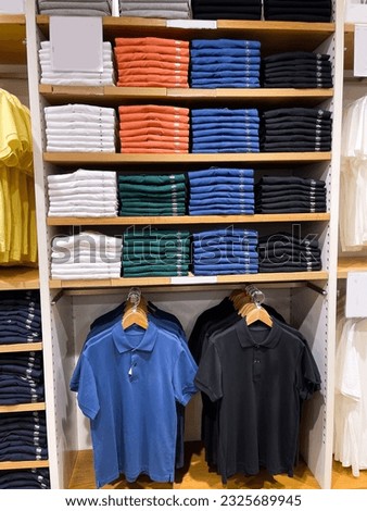 Colorful polo shirt on the shelf of a clothing store