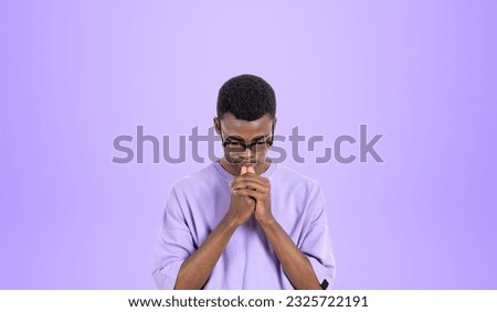Portrait of young African man college student in casual clothes and glasses thinking hard standing over purple background. Concept of brainstorming and career choice